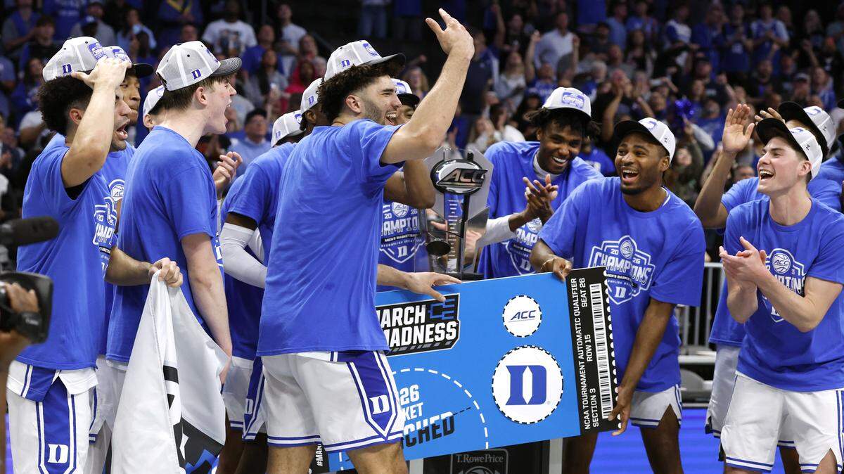 The Duke team celebrates after they “punched their ticket” to the NCAA Tournament after Duke’s 74-70 victory over Virginia in the finals of the 2026 ACC Men’s Basketball Tournament at the Spectrum Center in Charlotte, N.C., Saturday, March 14, 2026.