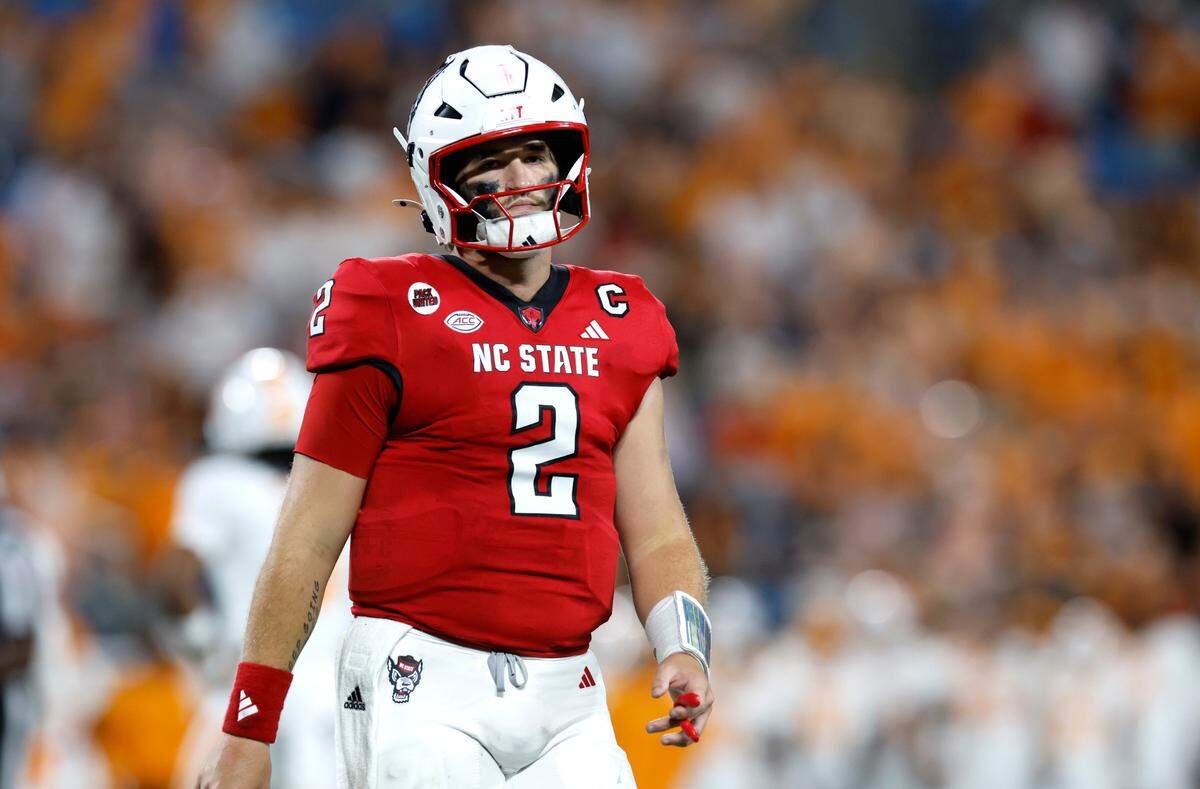 N.C. State quarterback Grayson McCall (2) heads back to the sidelines after the Wolfpack turned the ball over on downs during the second half of Tennessee’s 51-10 victory over N.C. State in the Duke’s Mayo Classic at Bank of America Stadium in Charlotte, N.C., Saturday, Sept. 7, 2024.
