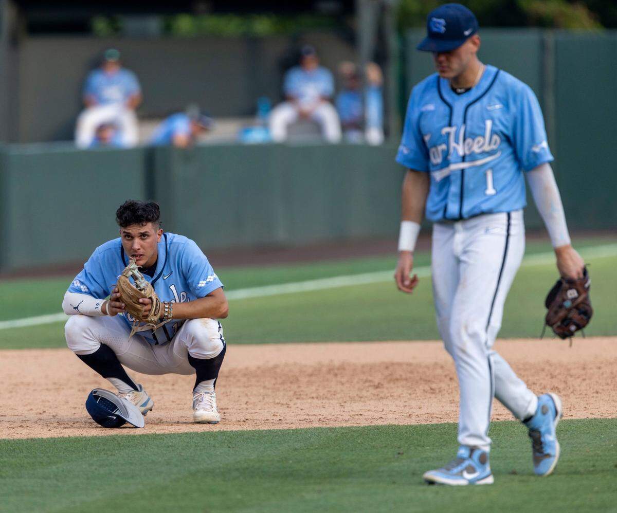 North Carolina third baseman Johnny Castagnozzi (19) and Danny Serretti(1) react following the Tar Heels 4-3 loss to Arkansas in the NCAA Super Regional series on Sunday, June 12, 2022 at Boshamer Stadium in Chapel Hill, N.C.