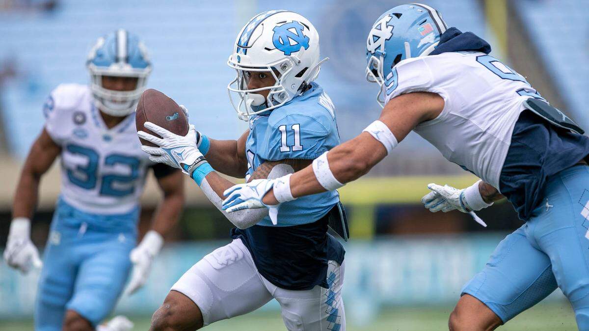 North Carolina’s Josh Downs (11) heads to the end zone for a touchdown after a pass reception from quarterback Jacolby Criswell (6) during the Tar Heels’ spring football game on Saturday, April 9, 2022 at Kenan Stadium in Chapel Hill, N.C.