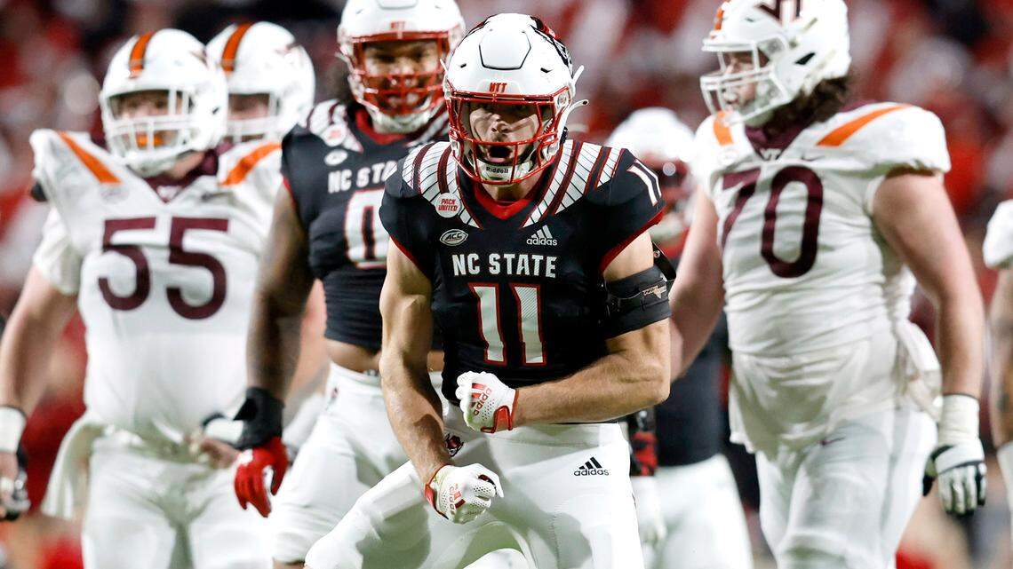N.C. State linebacker Payton Wilson (11) celebrates after sacking Virginia Tech quarterback Grant Wells (6) during the first half of N.C. State’s game against Virginia Tech at Carter-Finley Stadium in Raleigh, N.C., Thursday, Oct. 27, 2022.
