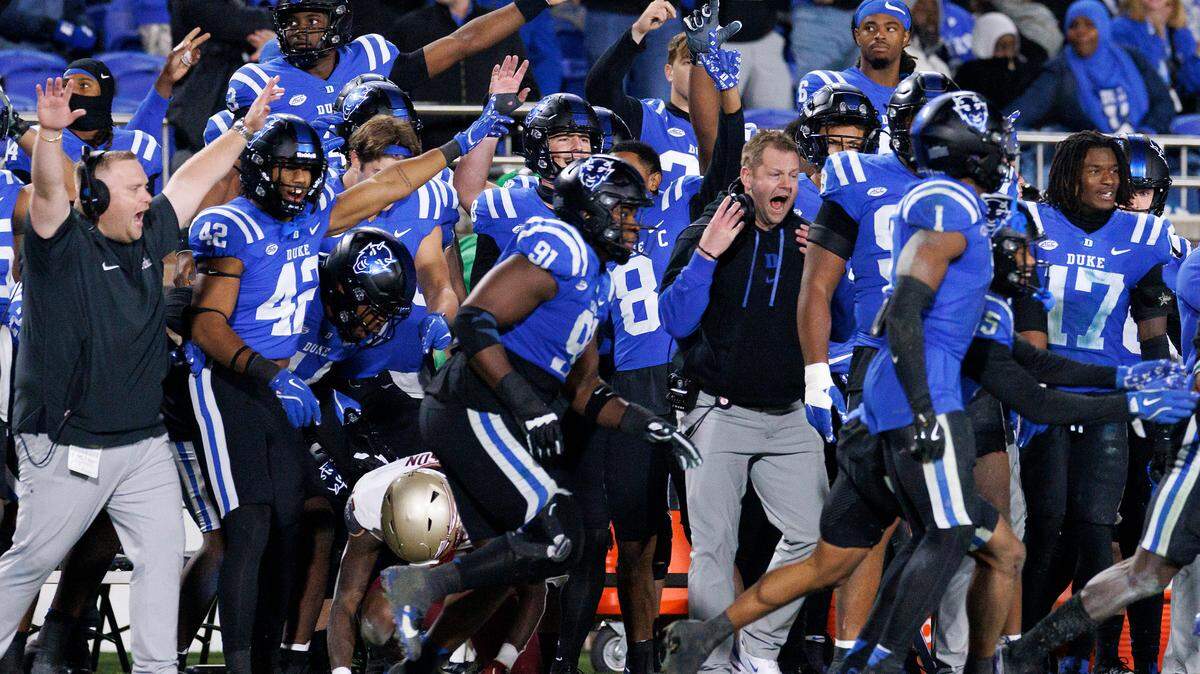 The Duke sideline celebrates after stopping Florida State on third down late in the fourth quarter of the Blue Devils’ 23-16 win on Friday, Oct. 18, 2024, at Wallace Wade Stadium in Durham, N.C.