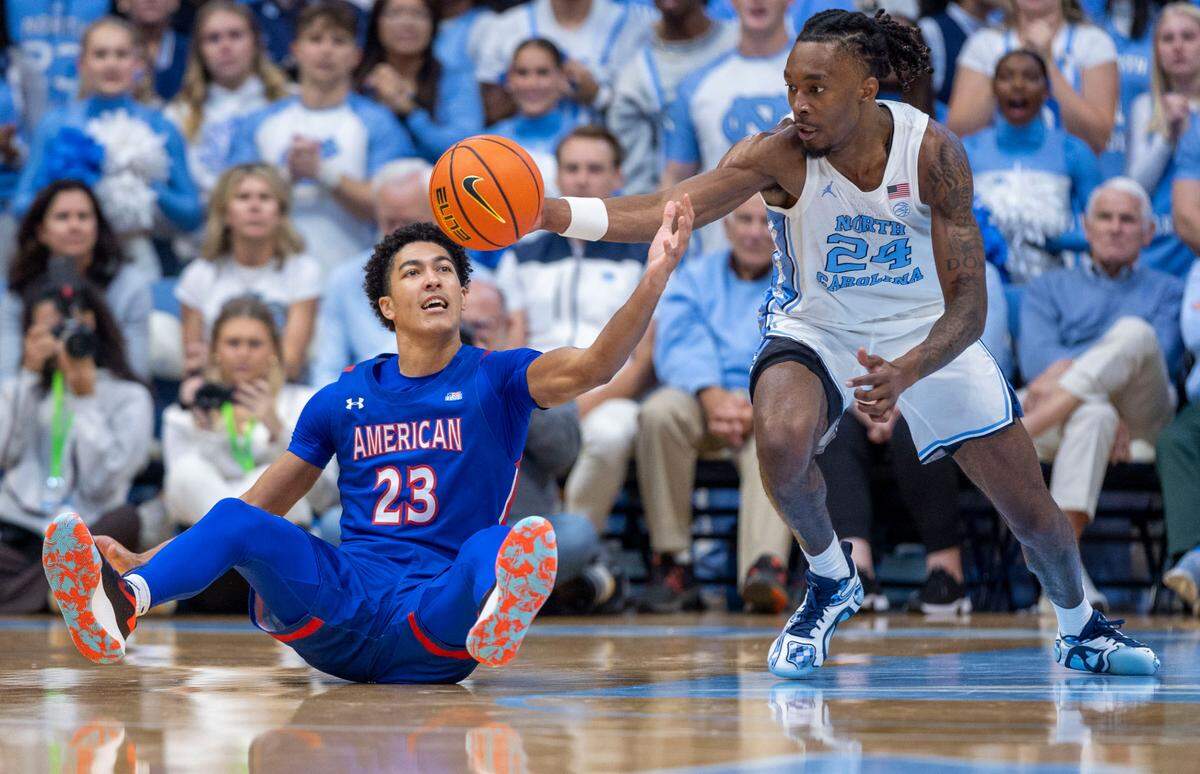 North Carolina forward Jae’Lyn Withers (24) makes a steal from American University’s Greg Jones (23) in the first half on Friday, November 15, 2024 at the Smith Center in Chapel Hill, N.C. in the first half on Friday, November 15, 2024 at the Smith Center in Chapel Hill, N.C.