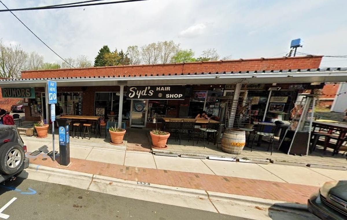 Rumors (left), a vintage thrift store on North Graham Street in Chapel Hill, and Syd’s Hair Shop next door are two of the over 260 Orange County Living Wage-certified businesses in Orange County.