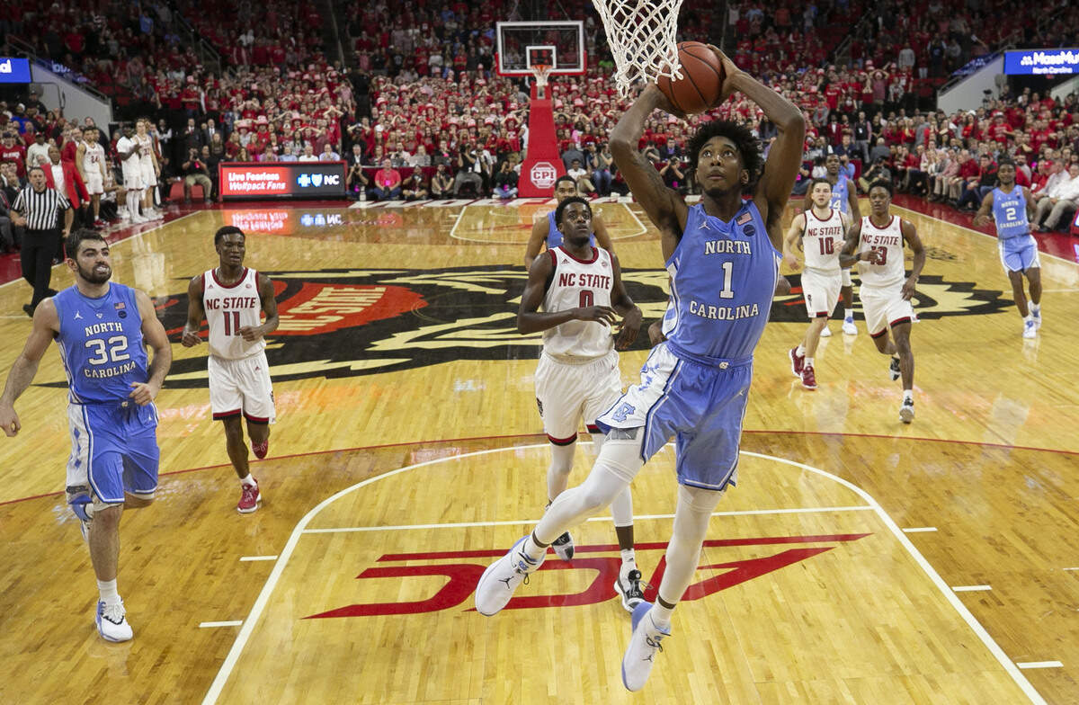 North Carolina’s Leaky Black (1) breaks to the basket for a dunk in the second half against N.C. State during the first half on Tuesday, January 8, 2019 at PNC Arena in Raleigh, N.C.