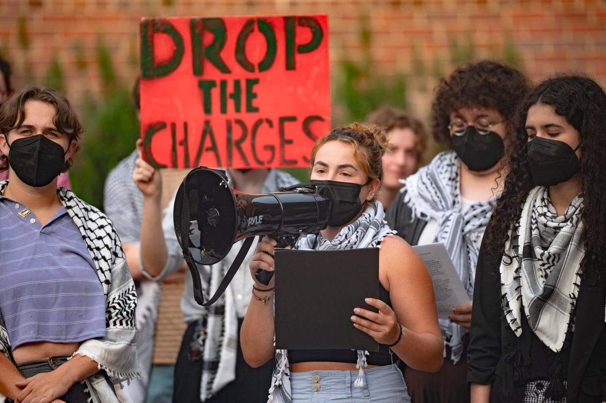 People gather to share statements at the Peace and Justice Plaza outside the courthouse regarding the charges against pro-Palestine protesters and broader beliefs about the war on Tuesday, July 30, 2024.