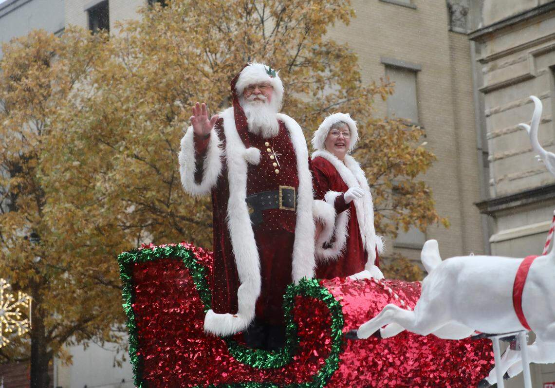 Santa Claus and Mrs. Claus wave to the crowd during the Raleigh Christmas Parade in Raleigh, N.C. on November 23, 2019.