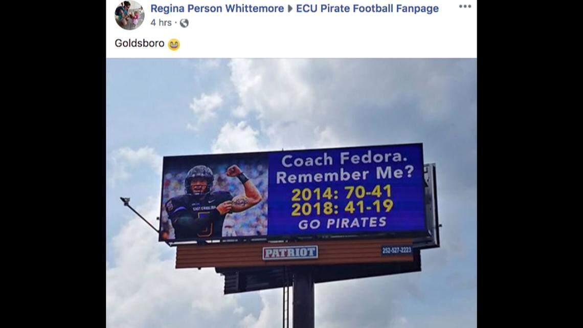 A screenshot of a Facebook post showing a billboard that trolls UNC Tar Heels over football losses to ECU.