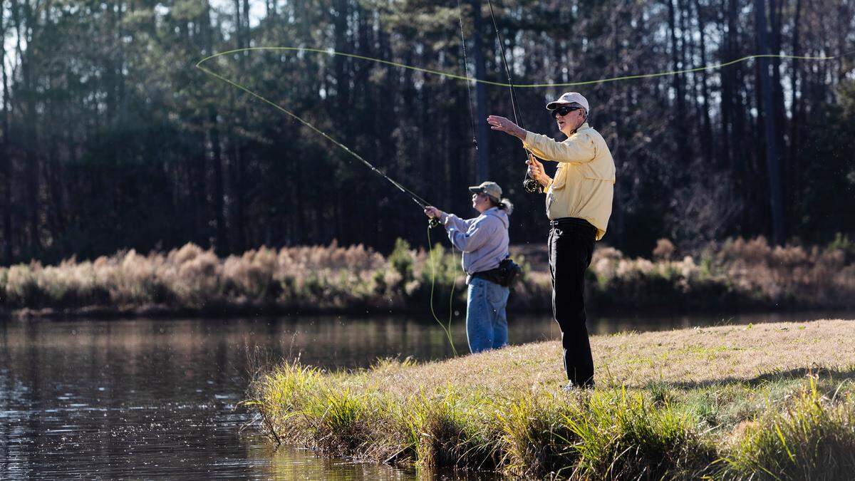 Mark Francis, foreground, and Mike Shapiro fish Tuesday, January 8, 2019 on the former Crooked Creek Golf Course in Fuquay-Varina. The Wake County Board of Commissioners voted late Monday night to put the property up for sale despite a previous vote to make the land a future park.