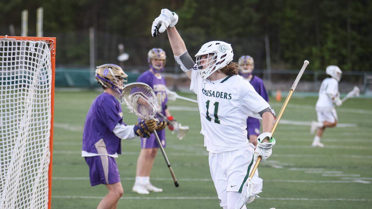 Cardinal Gibbons’ Logan Ritsema (11) celebrates a goal. The Broughton Capitals visited the Cardinal Gibbons Crusaders in a high school boys lacrosse game on Friday, April 20, 2018.