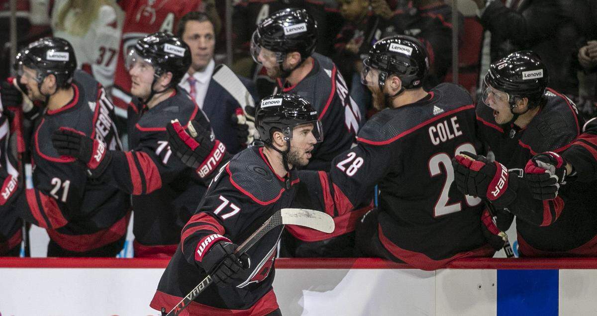 Carolina Hurricanes Tony DeAngelo (77) reacts as he skates to the bench after scoring a goal in the first period to give the Hurricanes a 2-0 lead over Boston on Tuesday, May 10, 2022 during game five of their Stanley Cup first round series at PNC Arena in Raleigh, N.C.