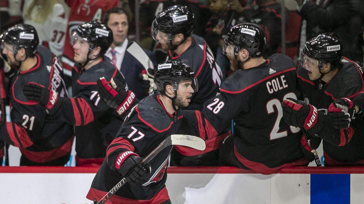Carolina Hurricanes Tony DeAngelo (77) reacts as he skates to the bench after scoring a goal in the first period to give the Hurricanes a 2-0 lead over Boston on Tuesday, May 10, 2022 during game five of their Stanley Cup first round series at PNC Arena in Raleigh, N.C.