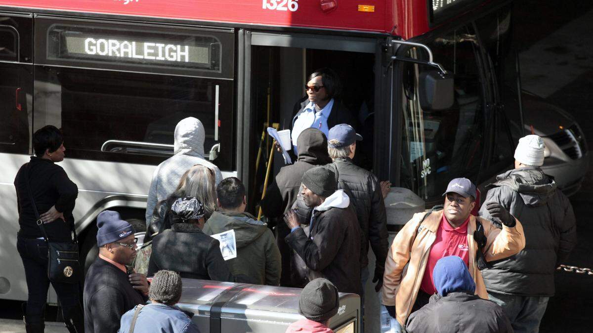 Bus patrons line up around the entrance to a just arrived GO Raleigh city bus at the Moore Square Station downtown Raleigh, Friday, February 19, 2016 as the bus driver gets off briefly, top center. Friday was the groundbreaking ceremony  for the GoRaleigh Station Renovation that will add a transit bus lane and upgrade facilities over the next year.