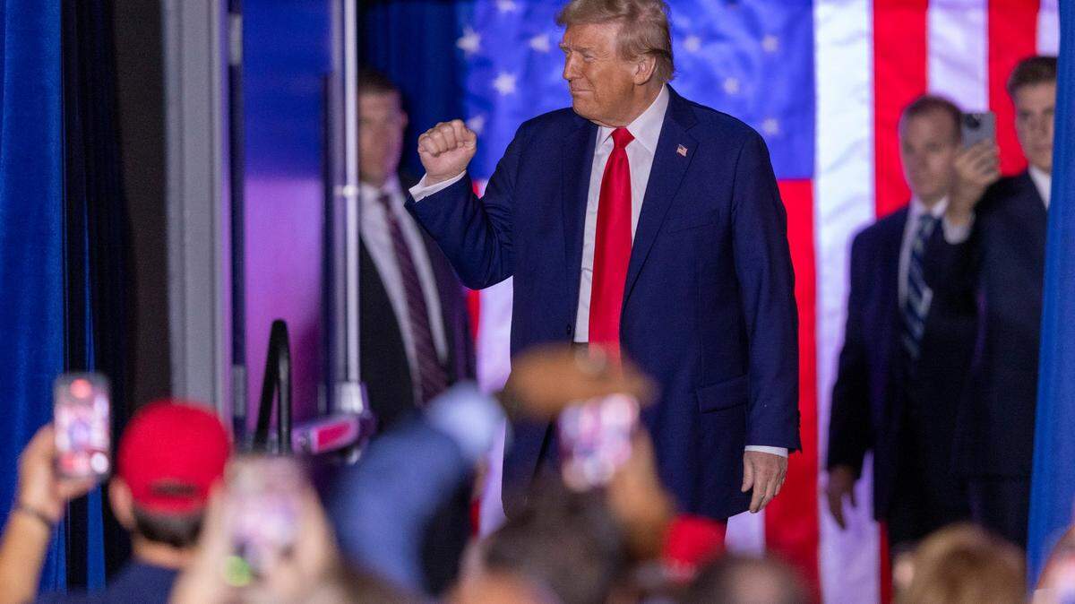 Former President Donald Trump takes the stage during a rally at Minges Coliseum in Greenville, S.C., on Monday, Oct. 21, 2024.