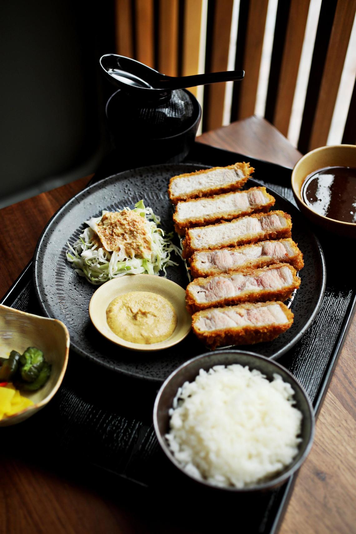 M Tempura in Durham uses the traditional fresh Japanese milk crumbs for the fried Japanese specialty: katsu. The katsu sets, including the kurobuta pork pictured here, are only served at lunch and include miso soup, rice, mixed pickles, shredded cabbage, and katsu sauce on the side.