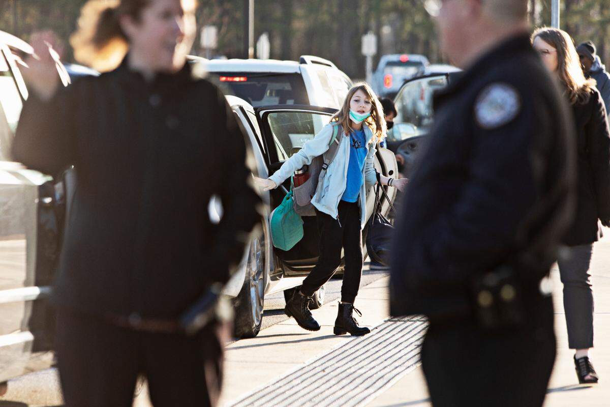 Swift Creek Middle School exit drop-off Monday morning Feb. 21, 2022 in Clayton. Johnston County is the first major Triangle NC school district to enact optional mask policy. More are following suit, but parents and teachers have mixed feelings.