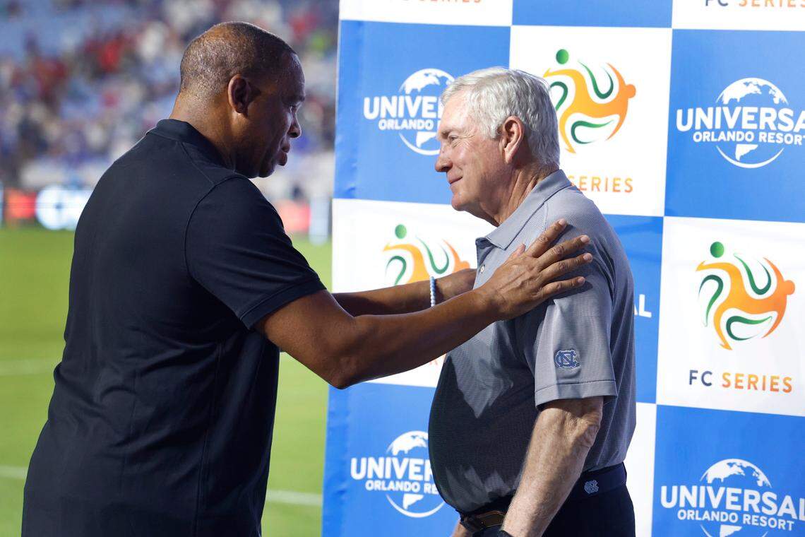 UNC basketball coach Hubert Davis talks with football coach Mack Brown after Chelsea Football Club’s 5-0 victory over Wrexham AFC in a friendly match at Kenan Stadium in Chapel Hill, N.C., Wednesday, July 19, 2023.
