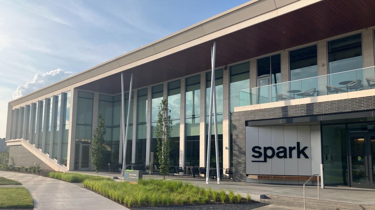 The Spark Life Sciences building in Morrisville. A black sign spelling "spark" is next to the door.