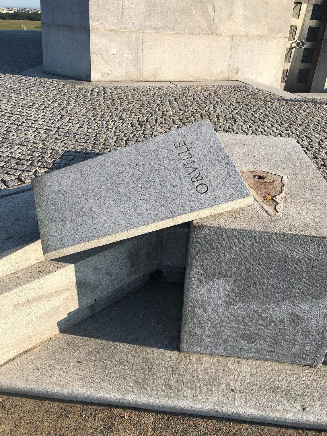 A sculpture of Orville Wright was stolen and the granite base it was mounted on was damaged at the Wright brothers monument in Kill Devil Hills, the National Park Service says.