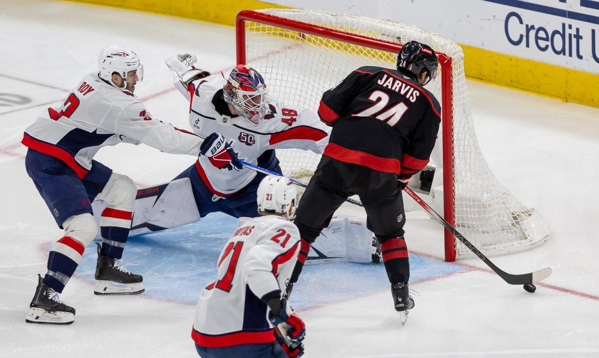 Carolina Hurricanes center Seth Jarvis (24) scores on Washington Capitals goalie Logan Thompson (48) to take a 2-0 lead in the second period during Game 4 of their series on Monday, May 12, 2025 at Lenovo Center in Raleigh, N.C.