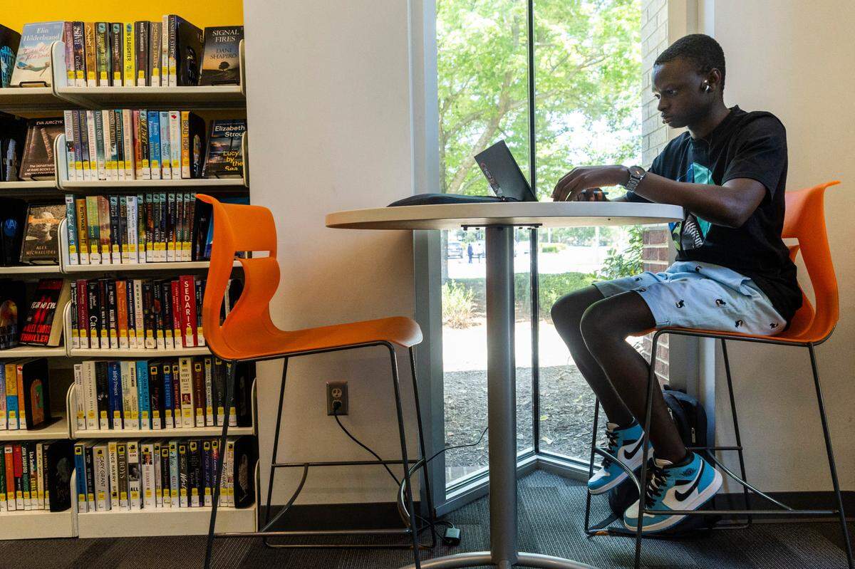 Wake Tech student, Alusine Kamara, studies at the Green Road Library in Raleigh on Tuesday, May 22, 2024.