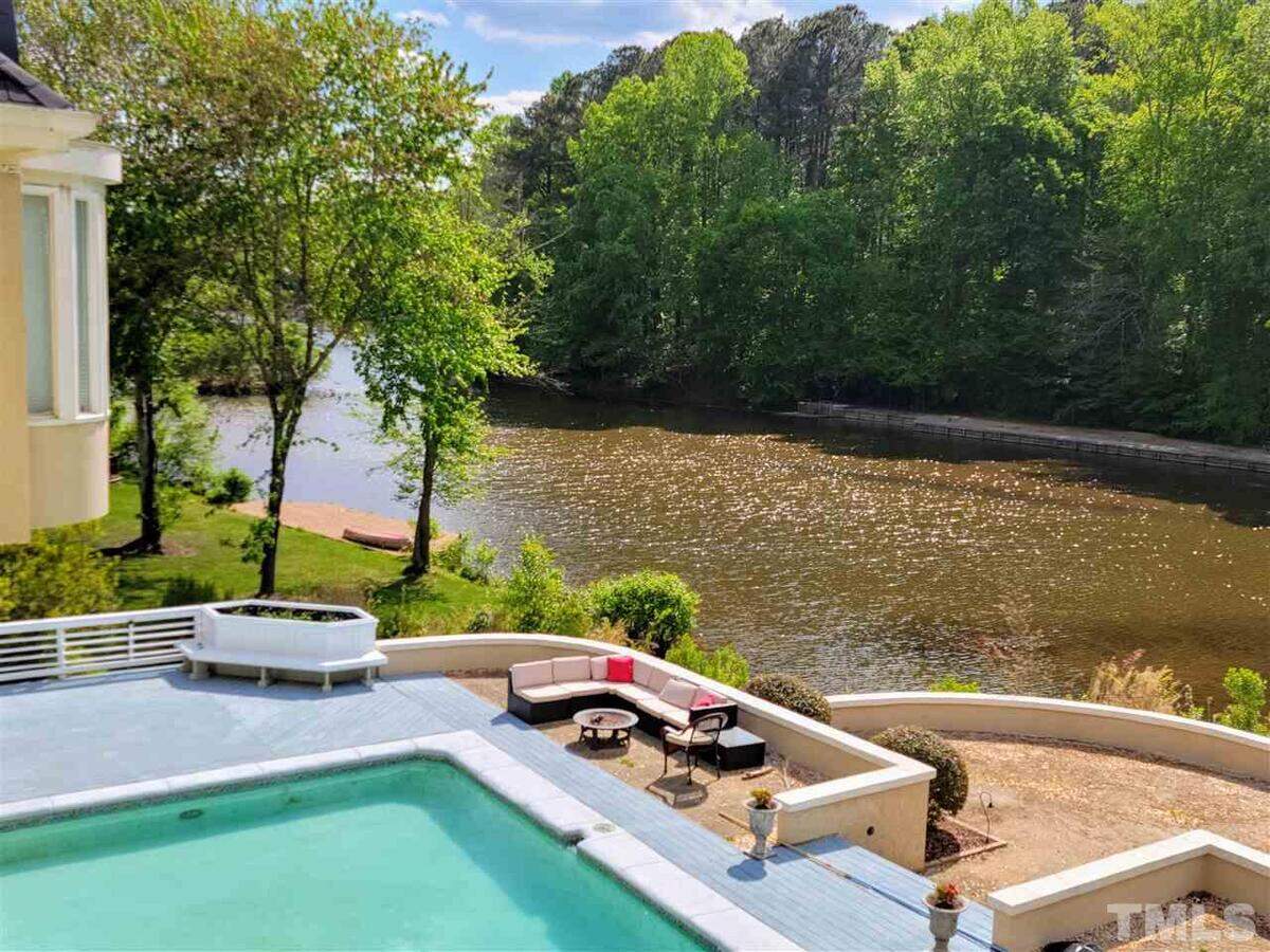 Located in the Lochmere golf and tennis community in Cary, this estate at 107 Headlands Lane sits on one acre where pool and water views can be seen from every room in the house, according to its real estate listing.