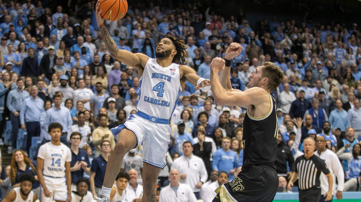 North Carolina’s R.J. Davis (4) drives to the basket against Wake Forest’s Andrew Carr (11) in the second half on Wednesday, January 4, 2023 at the Smith Center in Chapel Hill, N.C. Davis lead North Carolina with 27 points in their 88-79 victory.