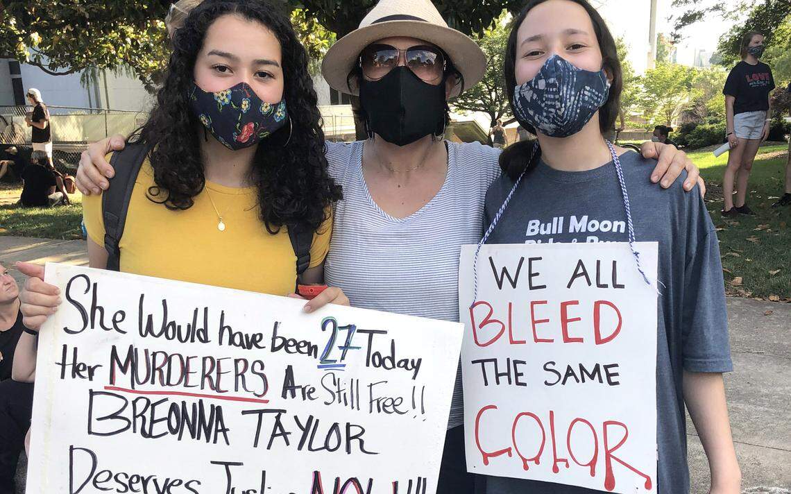 Angela Salamanca, 43, Raleigh, with daughters Sara Palacio, left, and Ana Palacio. “I think policy change is what I hope to see. And I think that’s on all of us, to really hold our local leaders accountable for the communities we want to live in.”