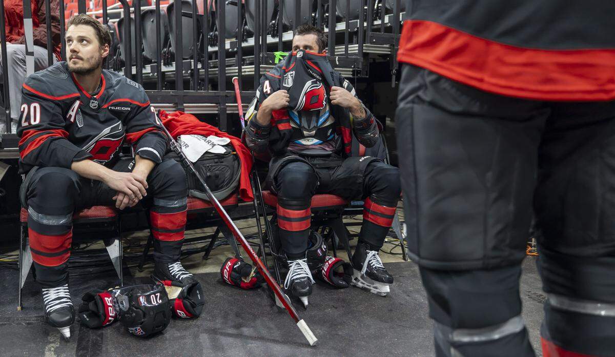 Carolina Hurricanes centers Sebastian Aho (20), Seth Jarvis (24) and Jordan Staal (11) wait their turn for a video shoot following their practice on Monday, June 1, 2026 at Lenovo Center in Raleigh, N.C.  