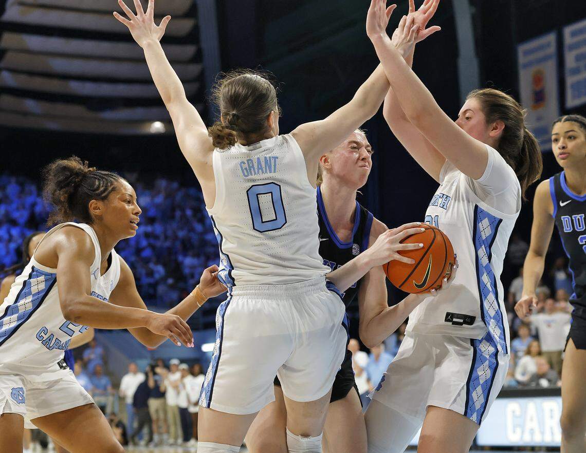 North Carolina’s Lanie Grant and Ciera Toomey pressure Duke’s Toby Fournier during the second half of the Tar Heels’ 74-69 win on Sunday, March 1, 2026, at Carmichael Arena in Chapel Hill, N.C. 