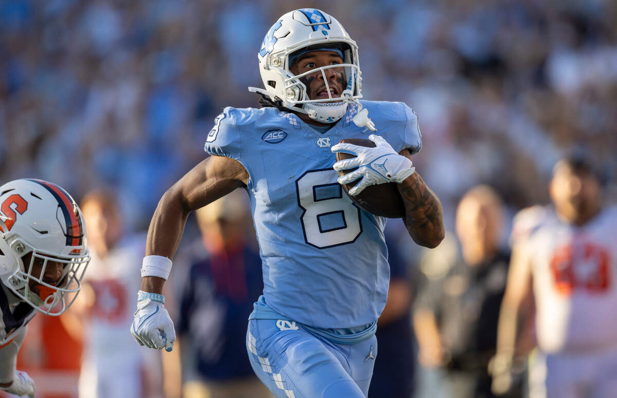North Carolina’s Kobe Paysour (8) scores on a 76-yard pass play from quarterback Drake Maye to give the Tar Heels’ a 37-7 lead in the third quarter on Saturday, October 7, 2023 at Kenan Stadium in Chapel Hill, N.C.