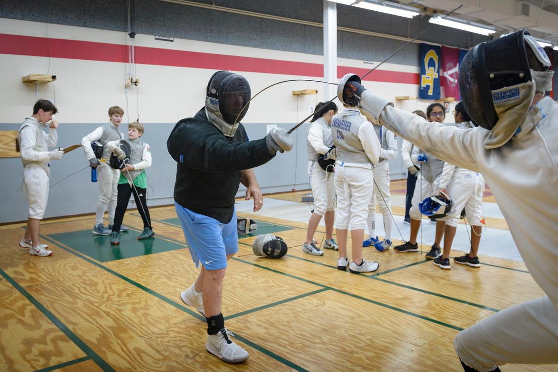 UNC-CH Fencing Head Coach Ron Miller gives a lesson at the Apex Fencing Academy in Apex, NC on June 27, 2019. Miller will be retiring after 52 years of coaching the UNC fencing team but will still stay active in the sport.