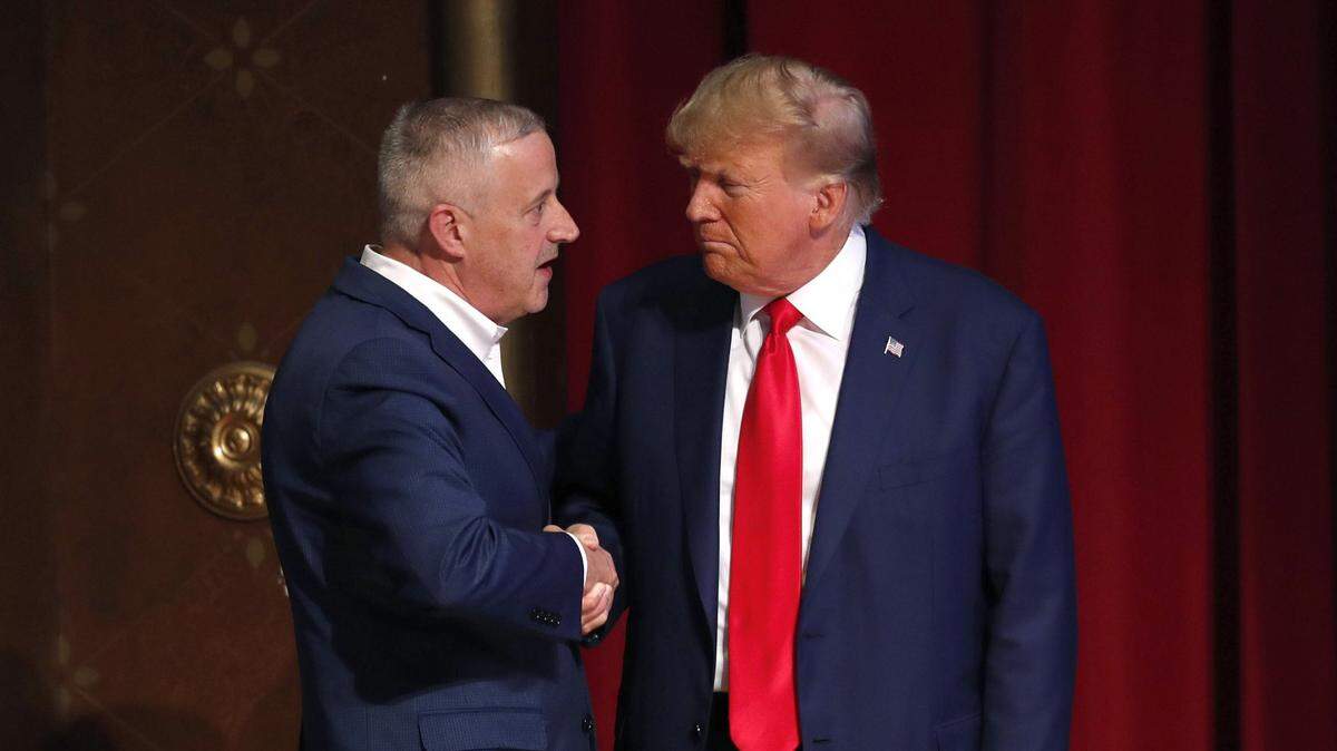 North Carolina Republican Party chairman Michael Whatley greets former President Donald Trump as he arrives for his address to the North Carolina Republican Party Convention at the Koury Convention Center on Saturday, June 10, 2023 in Greensboro, N.C.