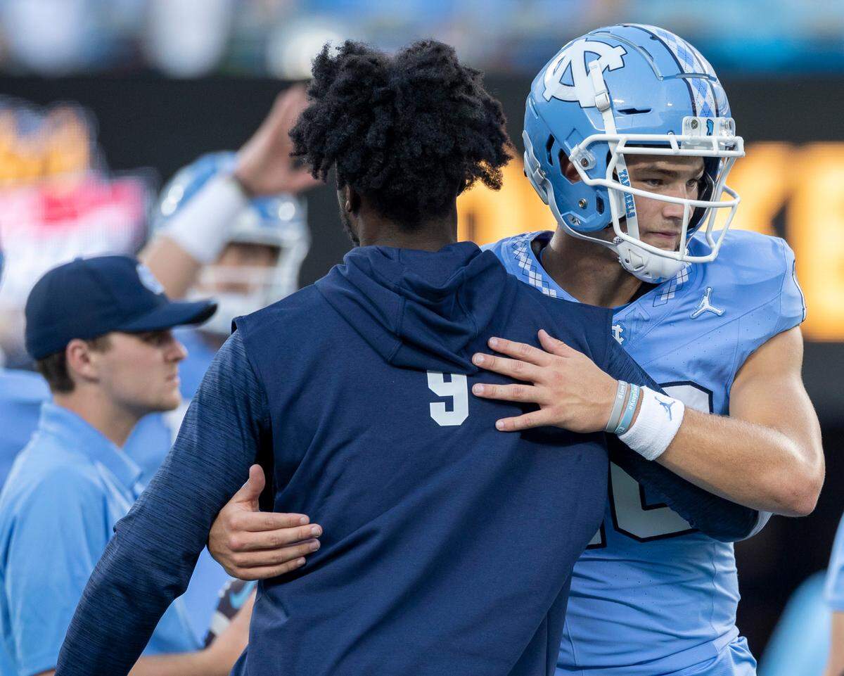 North Carolina quarterback Drake Maye (10) embraces Devontez Walker (9) prior the Tar Heels’ game against South Carolina on Saturday September 2, 2023 at Bank of America Stadium in Charlotte, N.C. Walker is appealing an NCAA ruling that declared him ineligible for the 2023 season.