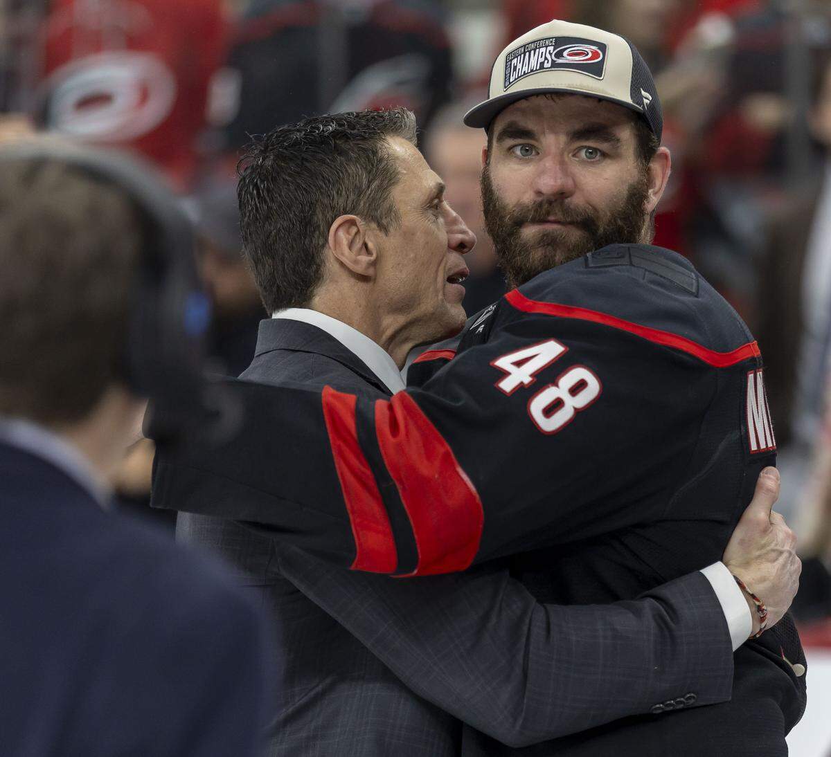 Carolina Hurricanes head coach Rod Brind’Amour embraces left wing Jordan Martinook (48) following their 6-1 victory over Montreal, clinching the Eastern Conference, and advancing to the Stanley Cup Finals on Friday, May 29, 2026 at Lenovo Center in Raleigh, N.C.