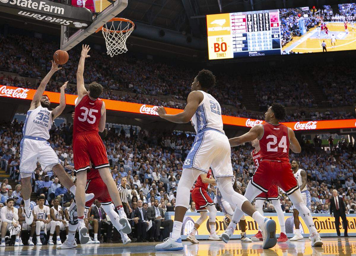 North Carolina’s Luke Maye (32) puts up a shot against Davidson’s Luka Brajkovic (35) during the second half on Saturday, December 29, 2018 at the Smith Center in Chapel Hill, N.C. Maye scored 11 point in the Tar Heels’ victory.