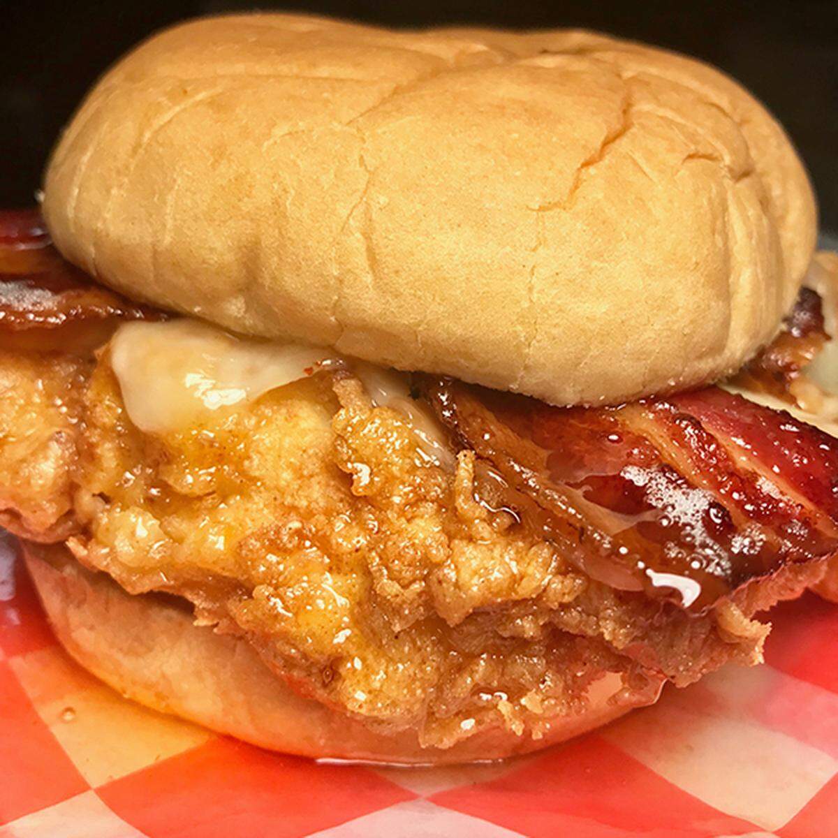 Say hello to The Chickonator, a fried chicken breast between two honey butter buns, topped with bacon and honey sauce.