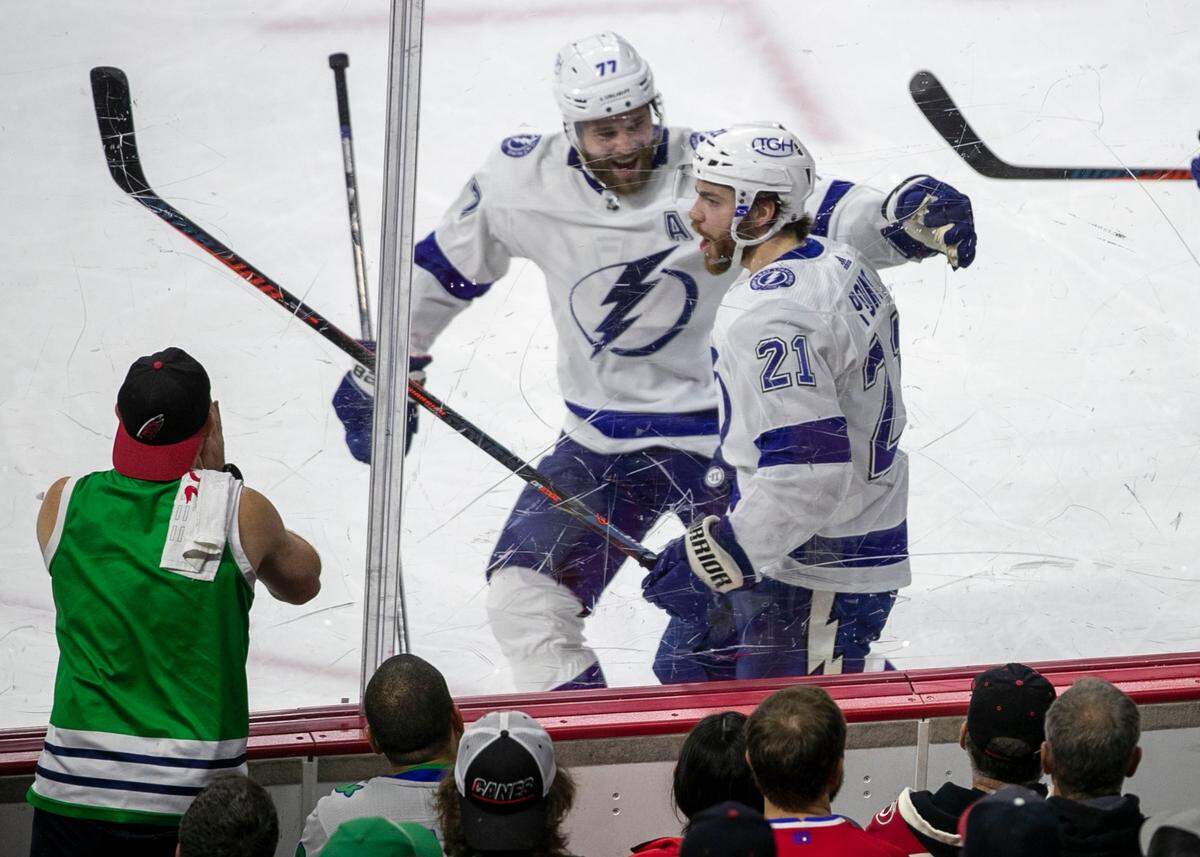 Tampa Bay’s Brayden Point (21) celebrates after scoring on Carolina Hurricanes goalie Alex Nedeljkovic (39) to give the Lightning a 1-0 lead in the second period in game five of their Stanley Cup series on Tuesday, June 8, 2021 at PNC Arena in Raleigh, N.C.