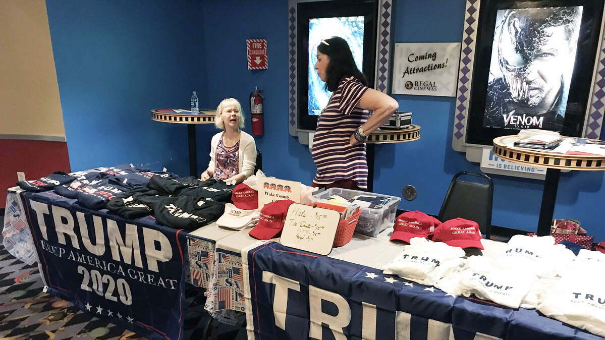 Volunteers for the Wake County Republican Party on Wednesday erected a booth at the Regal Crossroads Stadium 20 in Cary as they promoted a screening of the Dinesh D’Souza movie, “Death of a Nation.”
