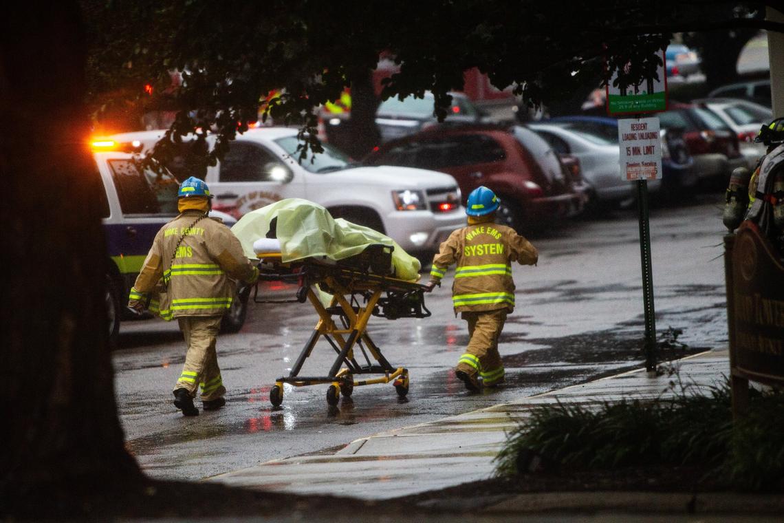 Emergency personnel respond to the scene of an apartment fire at Glenwood Towers, a senior-living complex in downtown Raleigh, Friday, Oct. 26, 2018.
