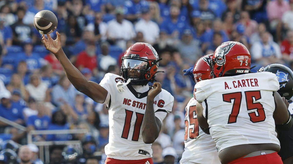 N.C. State quarterback CJ Bailey (11) throws during the first half of N.C. State’s game against Duke at Wallace Wade Stadium in Durham, N.C., Sat. Sept. 20, 2025