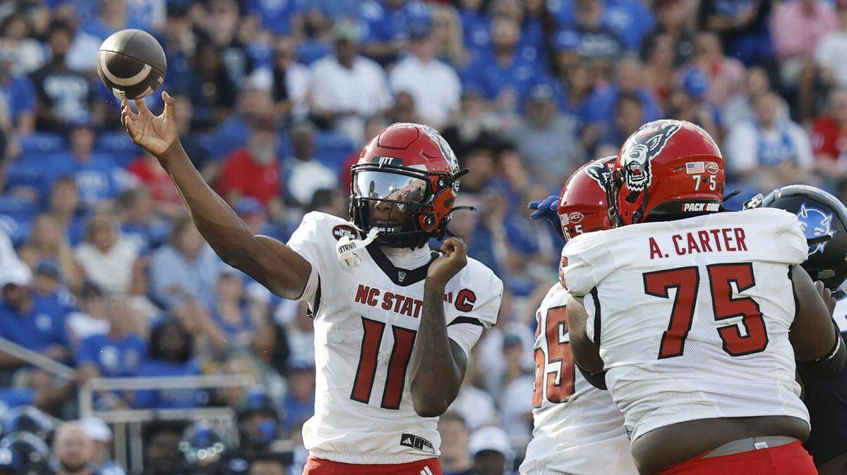 N.C. State quarterback CJ Bailey (11) throws during the first half of N.C. State’s game against Duke at Wallace Wade Stadium in Durham, N.C., Sat. Sept. 20, 2025