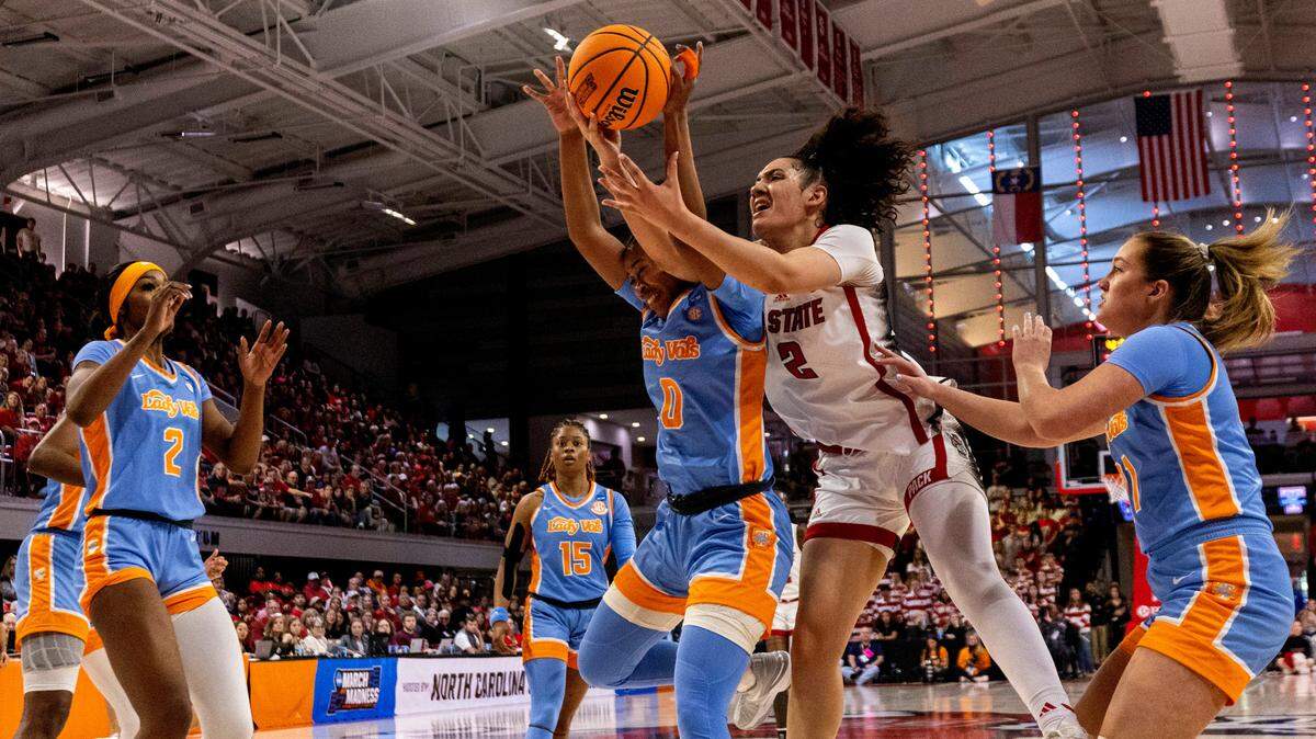 NC State’s Mimi Collins (2) gets tangled up with Tennessee’s Jewel Spear (0) during the first half of the second round of the Division I Women’s Basketball Championship at Reynolds Coliseum in Raleigh, North Carolina, on March 25, 2024.