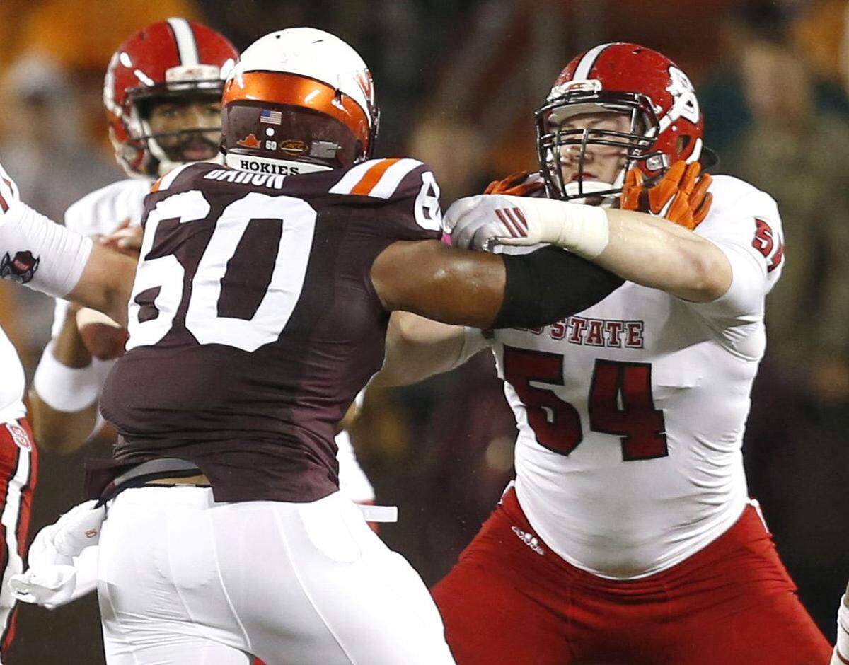 N.C. State’s Joe Thuney (54) protects quarterback Jacoby Brissett during the Wolfpack’s game against Virginia Tech at Lane Stadium in Blacksburg, Va. in October 2015.