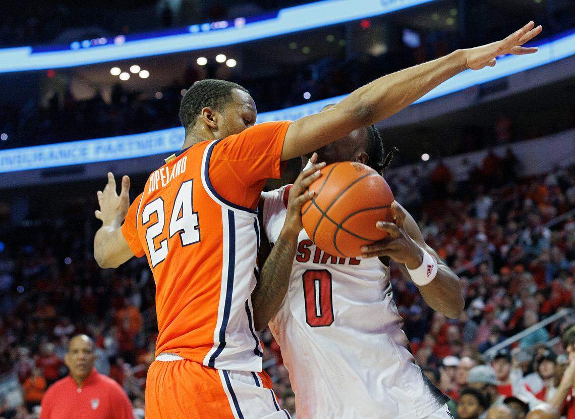 N.C. State’s DJ Horne drives against Syracuse’s Quadir Copeland during the closing seconds of the Wolfpack’s 87-83 loss on Tuesday, Feb. 20, 2024, at PNC Arena in Raleigh, N.C.