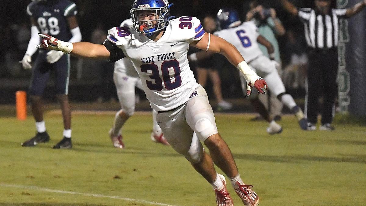 Wake Forest’s Zane Williams (30) celebrates in victory after Leesville Road fails to score in the second overtime The Wake Forest Cougars and the Leesville Road Pride met in a football game in Raleigh, N.C. on September 15, 2023.