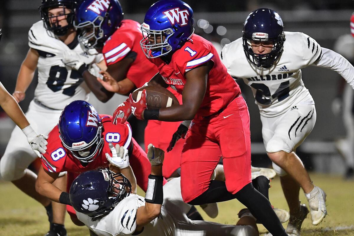 Wake Forest’s Nigel Lucas (1) runs the kickoff return against Millbrook during the second half. The Wake Forest Cougars and the Millbrook Wildcats met in a football game in Wake Forest, N.C. on October 28, 2022.