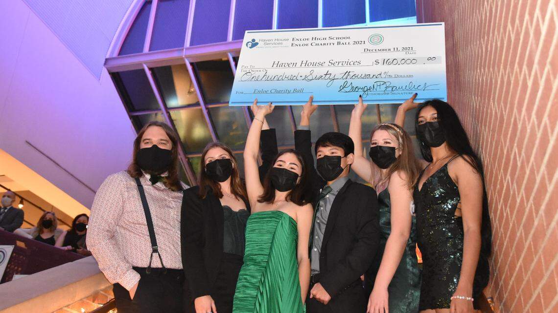 Leaders of the 2021 Enloe Charity Ball hold up the $160,000 check given to Haven House Services as part of this year’s fundraising effort. The check was presented at the ball held Dec. 11, 2021 at Marbles Kids Museum in Raleigh.