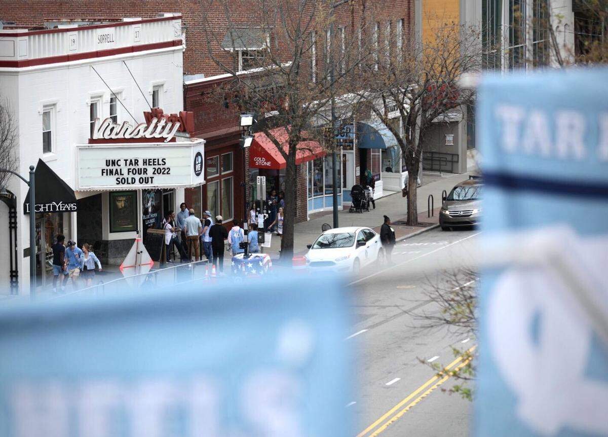 The marquee at the Varsity Theatre in downtown Chapel Hill, N.C., informs fans that seats were sold out for viewing the historic Final Four game between Duke and UNC on Saturday, April 2, 2022.