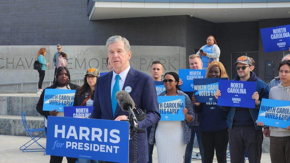 N.C. Democratic Gov. Roy Cooper talks to reporters after voting early for Kamala Harris on Tuesday, Oct. 29, 2024 at Chavis Park in Raleigh.